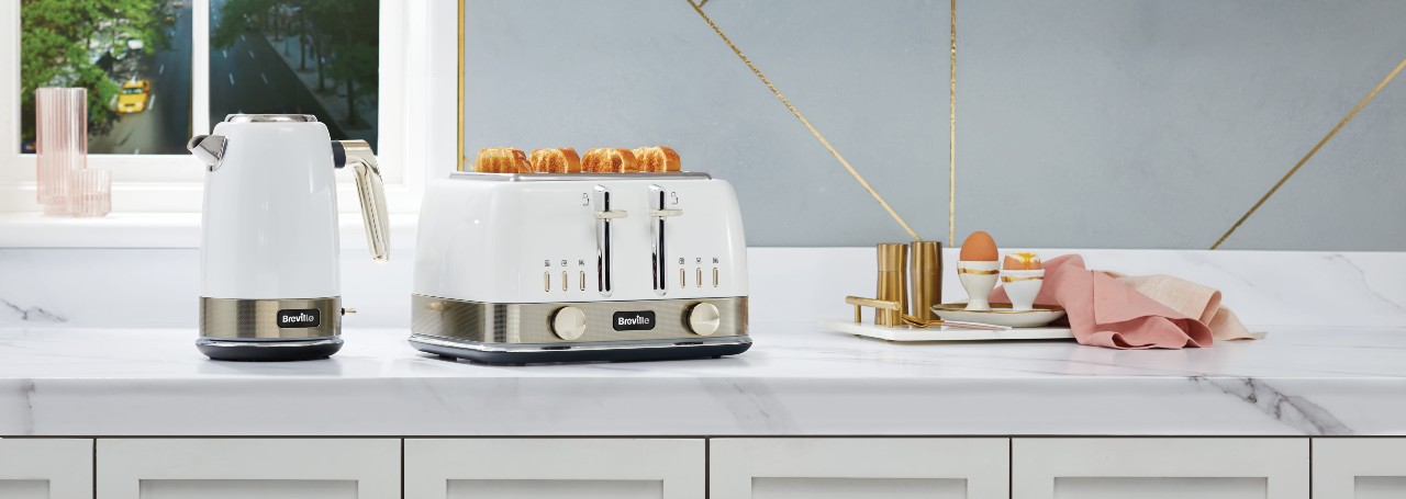 White Breville toaster & kettle on white worktop kitchen