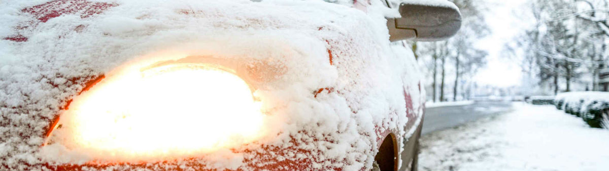 car in snow - winter motoring